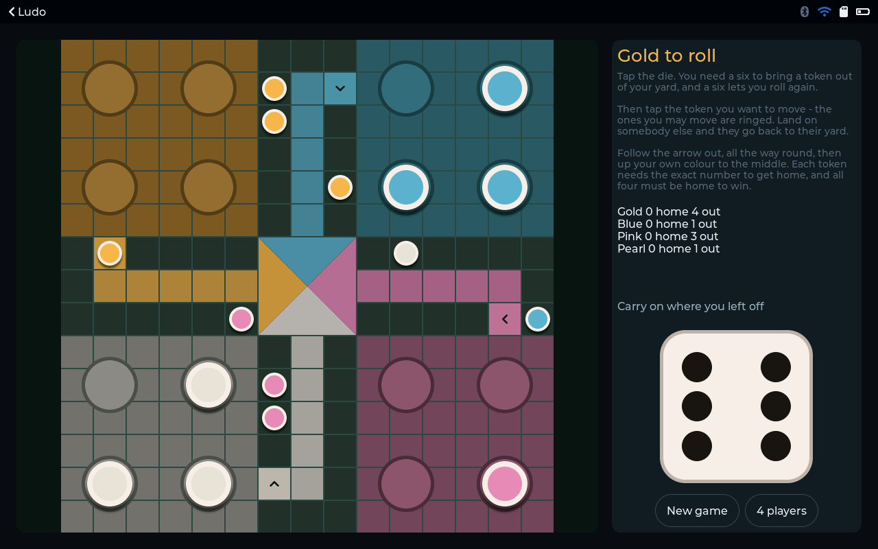 Ludo - Four players, one screen, nine tokens out on the track.